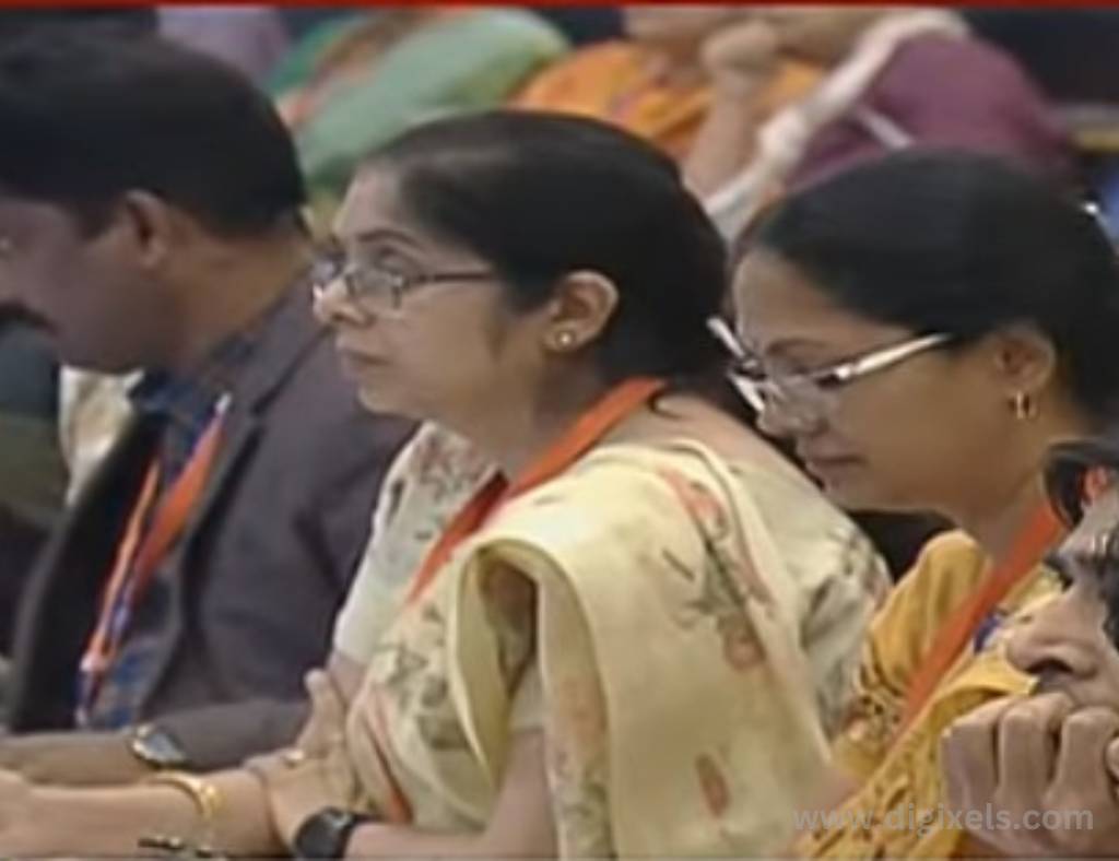 Chandrayaan 3 images, footage of mission chandrayaan 3 project team watching over the chandrayaan 3 module in ISRO center, two women wearing spake sitting close to each other.