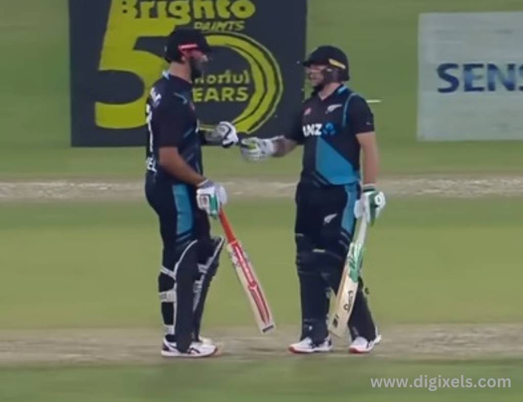 Cricket images of new zealand two batsmen standing with bat on hand encouraging each other.
