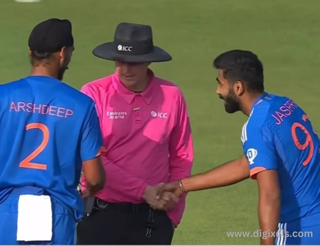 Cricket images of India, Jasprit Bhumra, Arshdeep, umpire, handshaking each other.