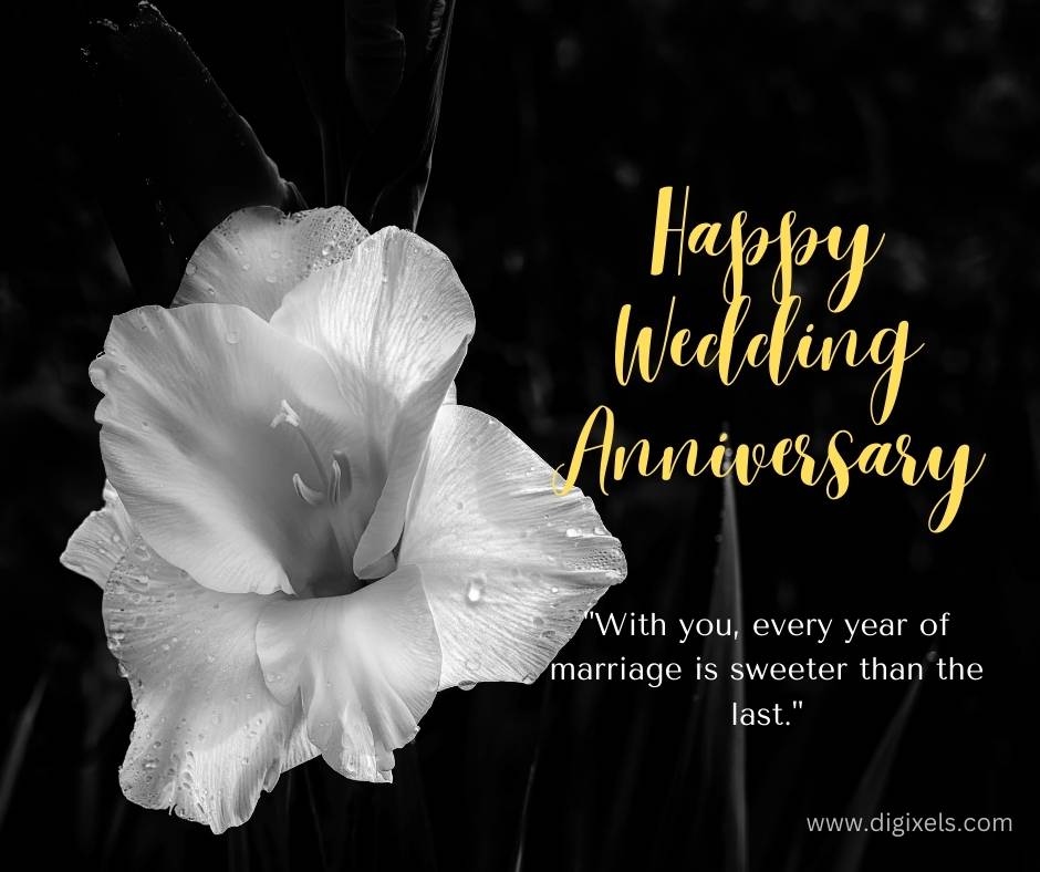 Happy anniversary images with white color flower, black background, looks beautiful, inspiring quotes, text, free download