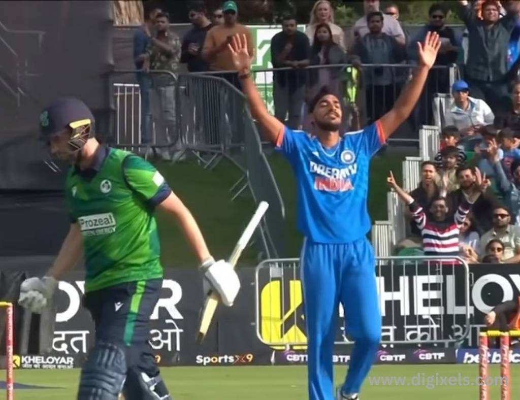 Cricket images of India bowler Arshdeep, lifting hand, Ireland batsman gone out.