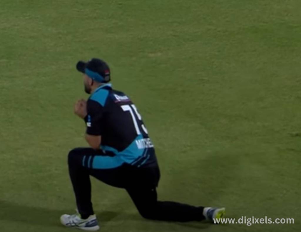 Cricket images of New Zealand fielder catching ball