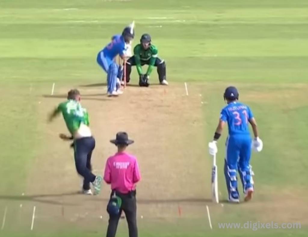 Cricket images of India batting, Ireland bowlling, umpire standing