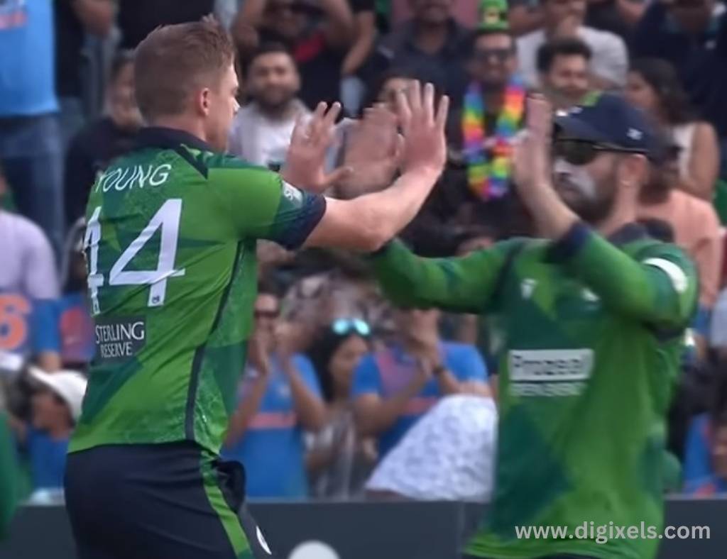 Cricket images of Ireland bowler celebrate with team member.