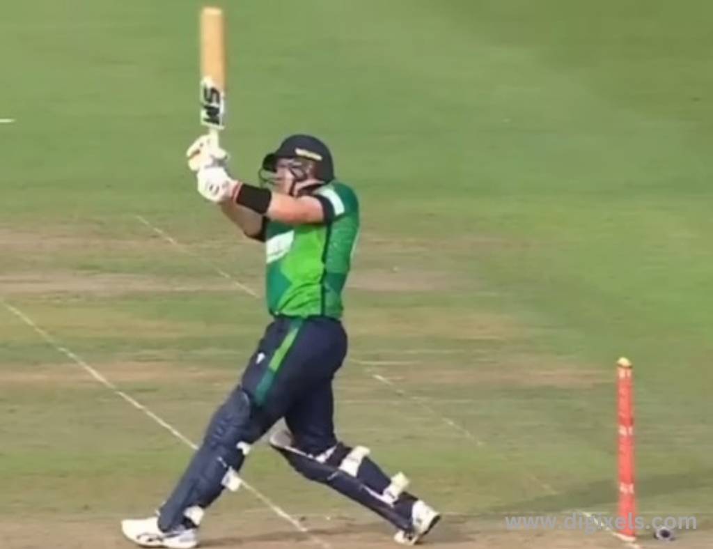 Cricket images of Ireland batsman hitting the ball, lifting up the bat.