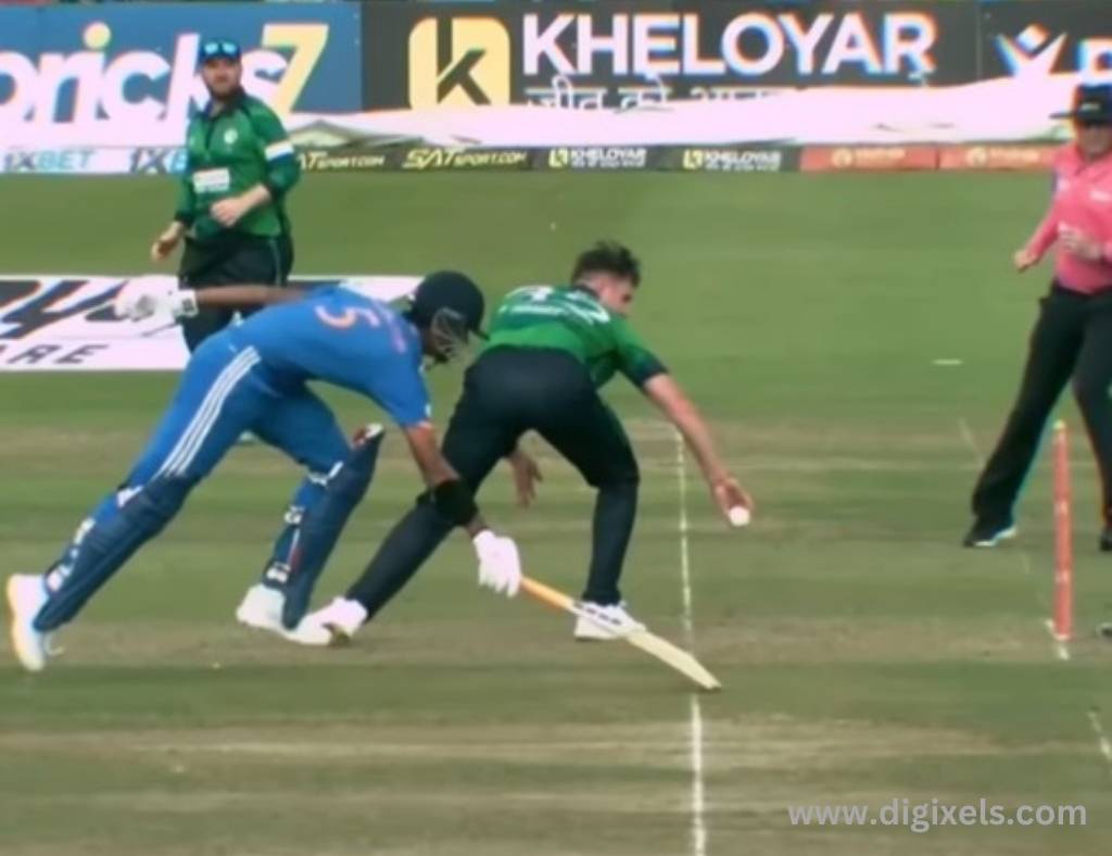 Cricket images of India batsman touch the wicket line, Ireland keeper trying to stamping the ball, umpire looking at them