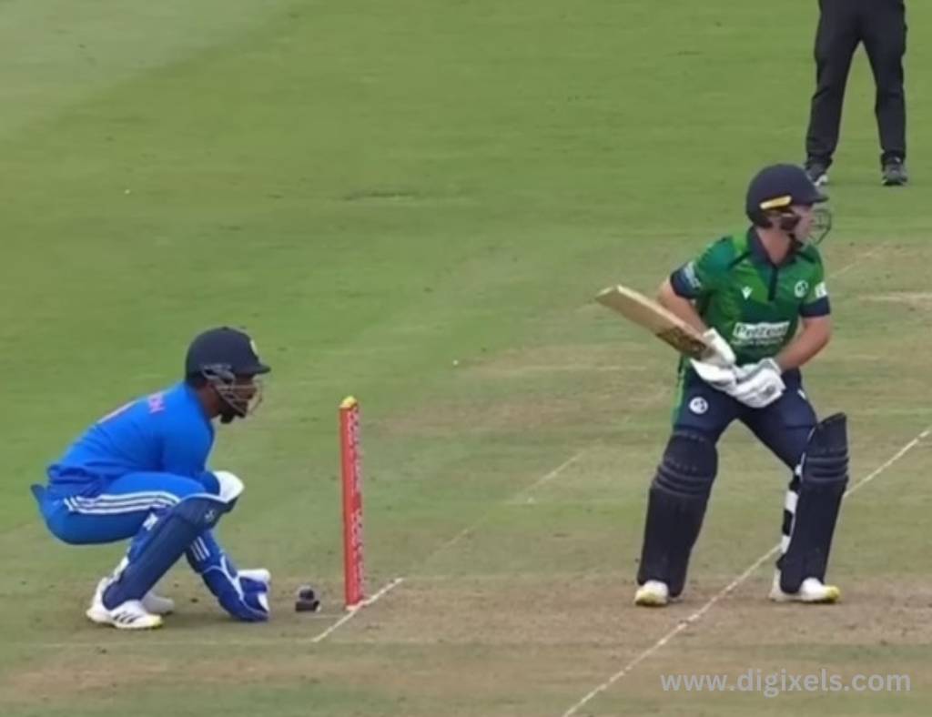 Cricket images of Ireland batsman ready to hit the ball, Indian wicket keeper ready at stamp.