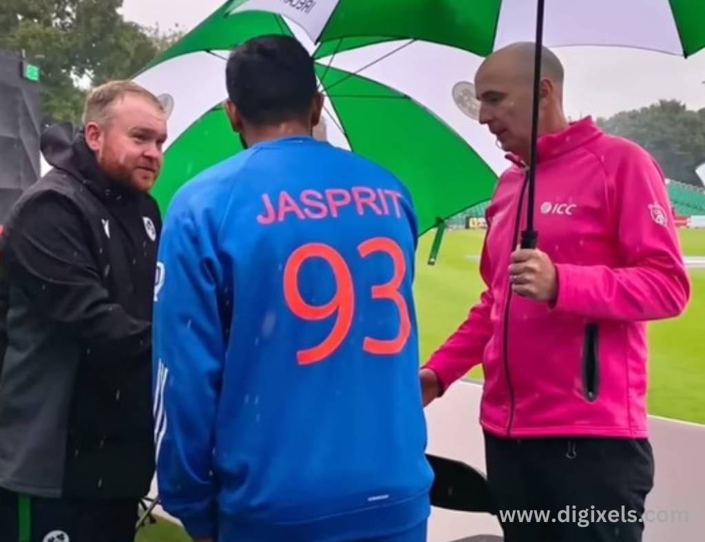 Cricket images of India vs. Ireland T20 Match, umpire carrying umbrella, Jasprit meeting with umpire.