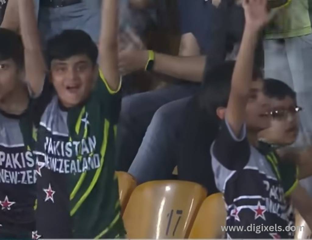 Cricket images of Pakistan supporter children, lifting hands and shouting
